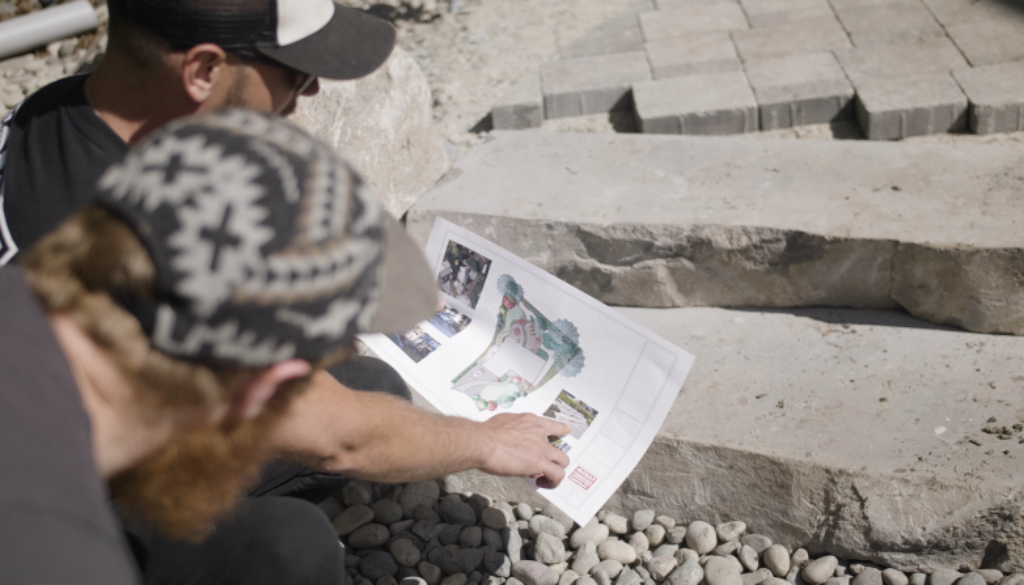 Landscapers reviewing design plans