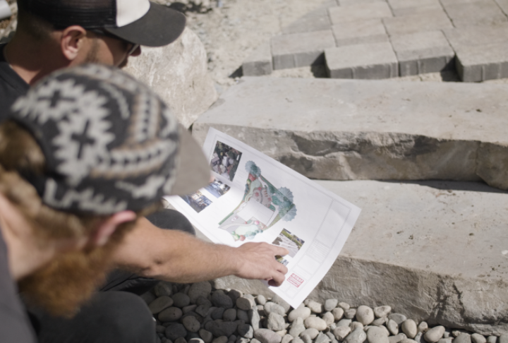 Landscapers reviewing design plans