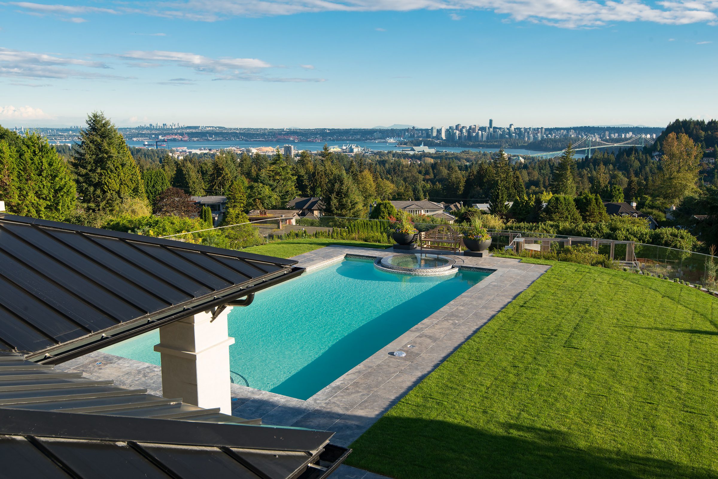 Infinity pool overlooking city skyline and bridge