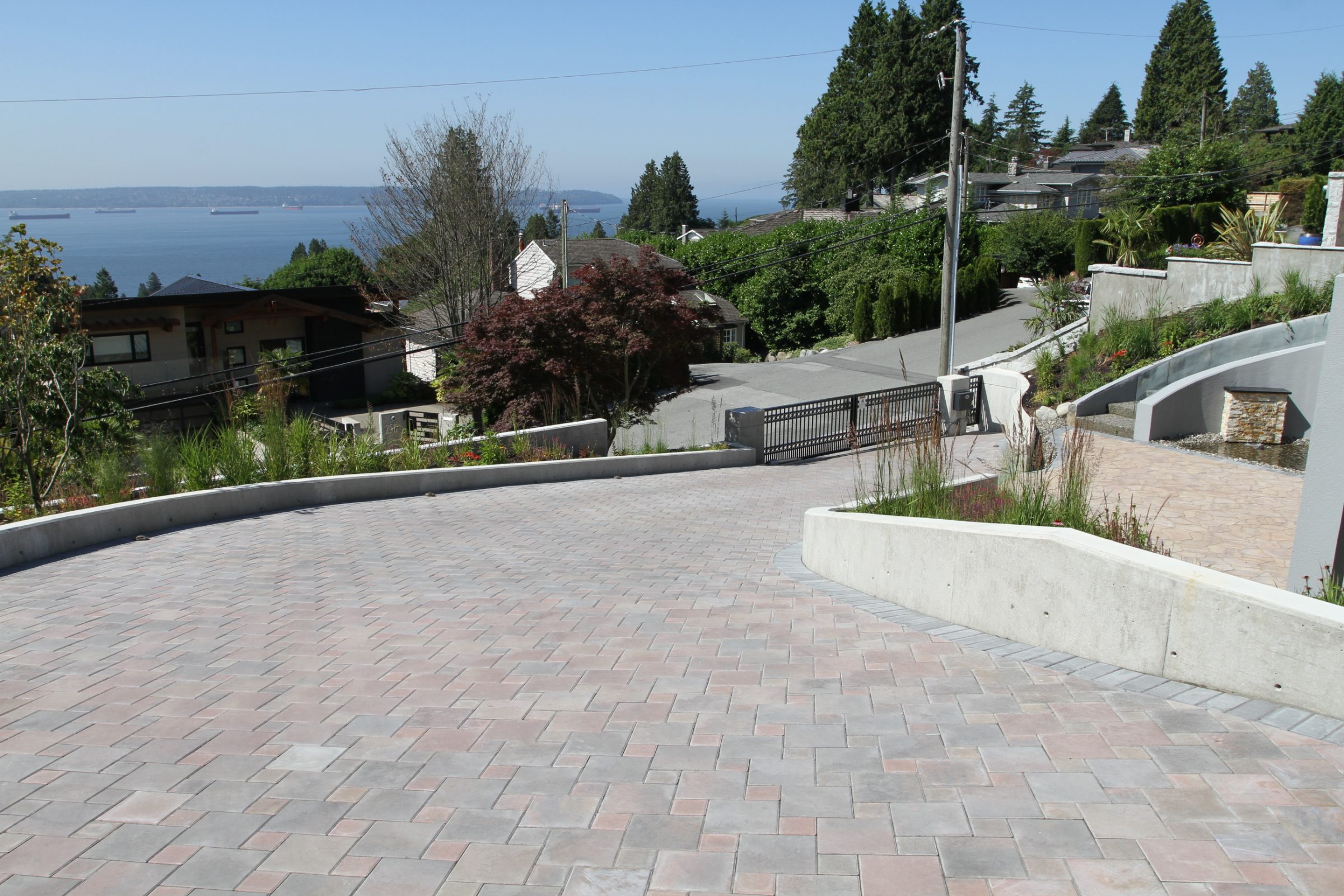 Sloped driveway overlooking waterfront neighborhood and bay