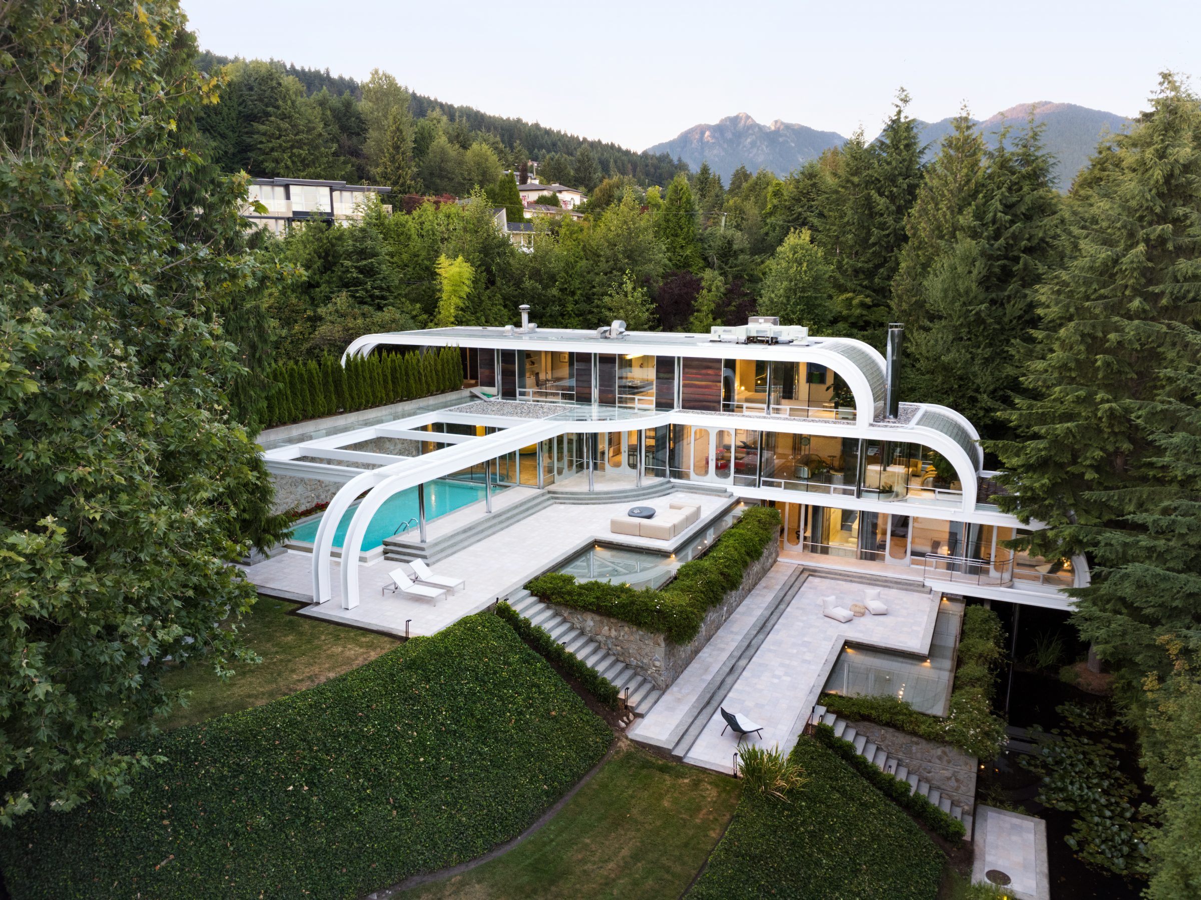 Modern hillside mansion with pool and mountain views