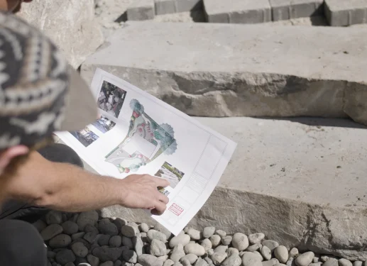 Two landscapers reviewing design plans