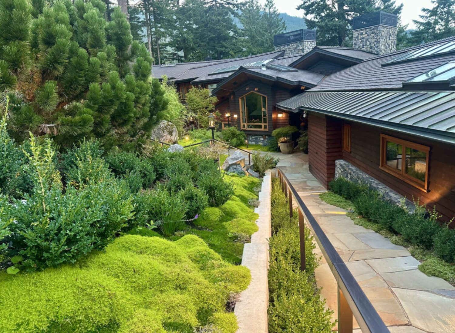 Modern rustic home with lush landscaped garden
