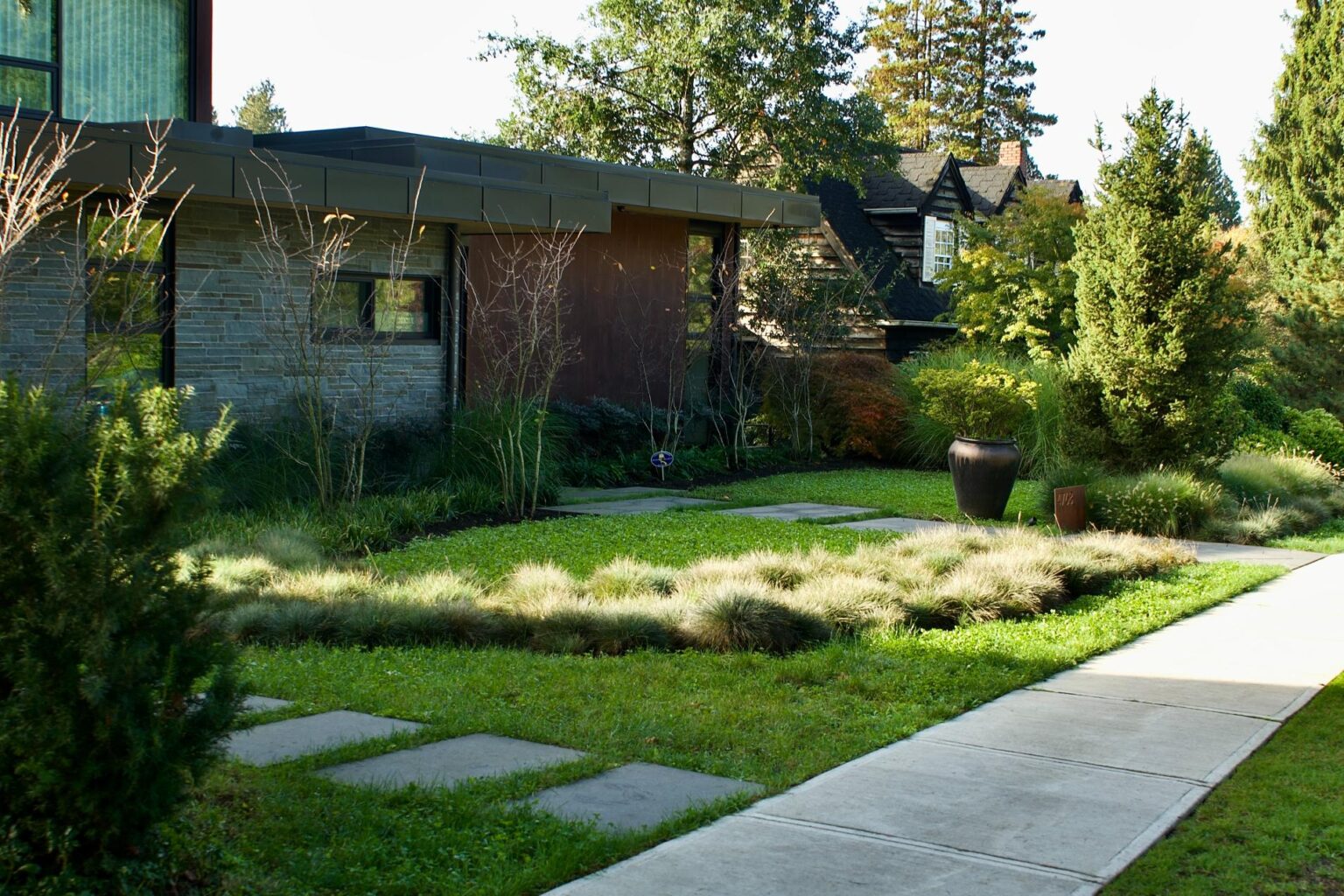 Modern home with landscaped front yard and lawn