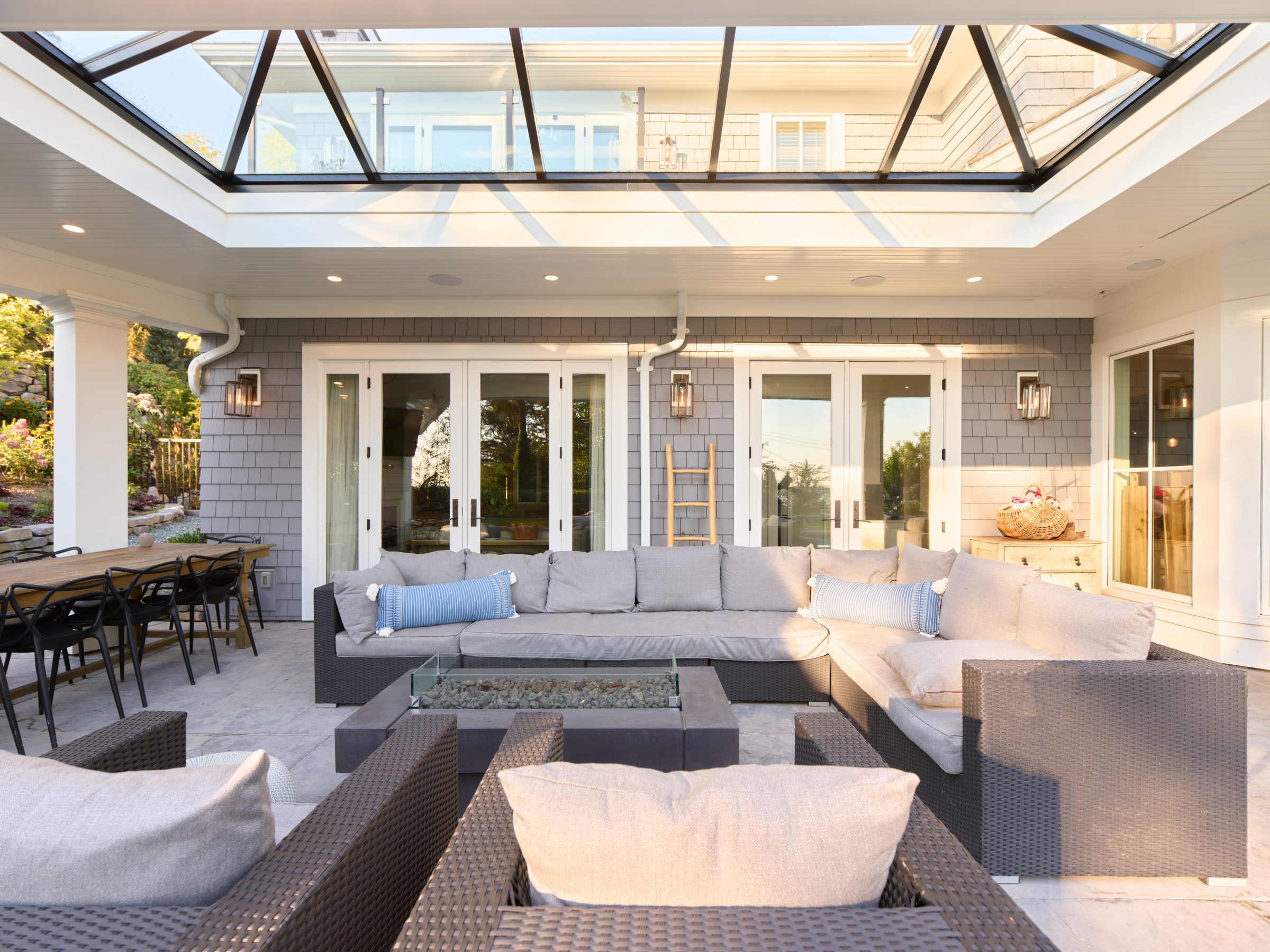 Modern covered patio with sectional sofa and fire pit