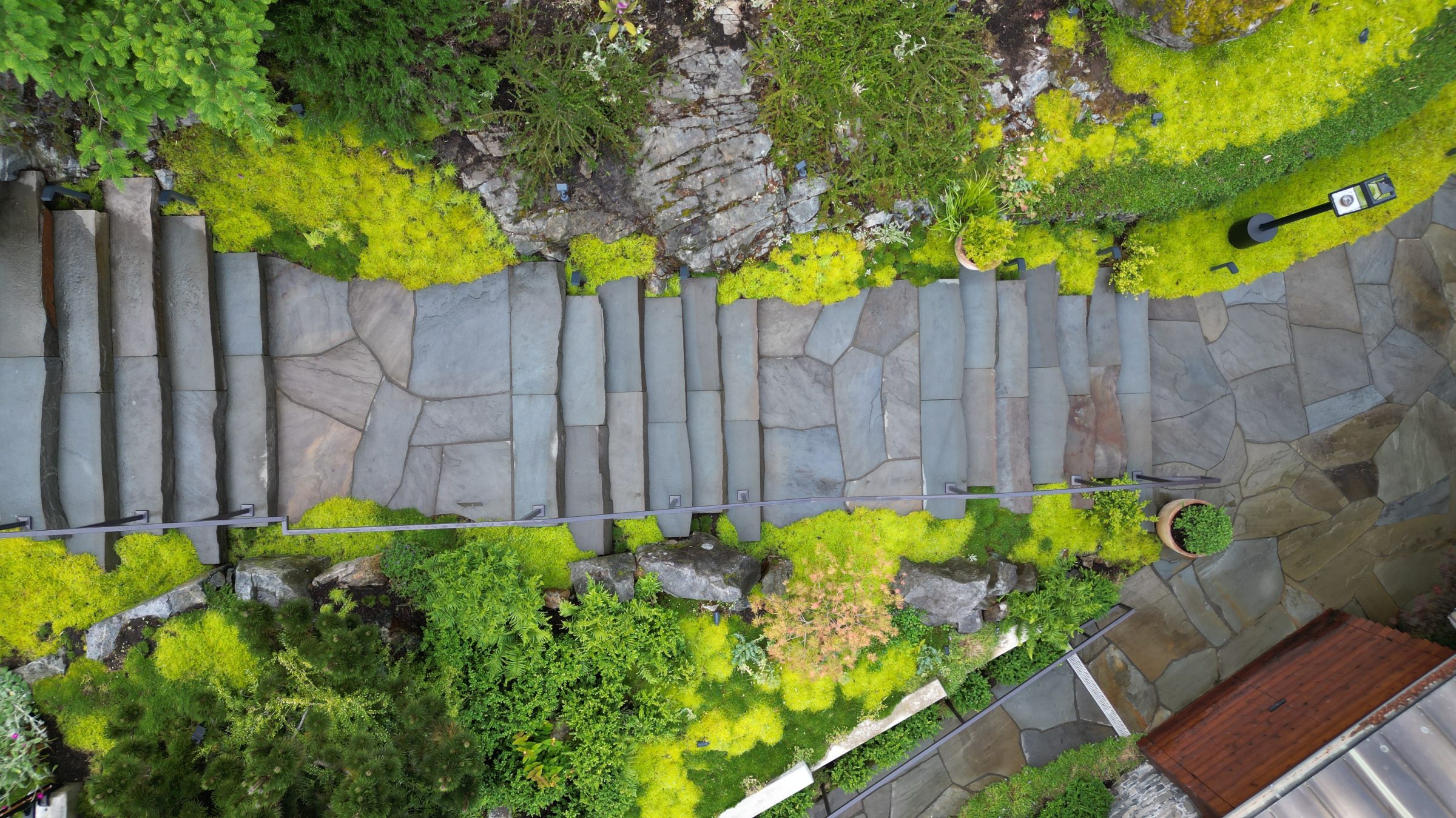 Aerial view of stone steps in lush garden