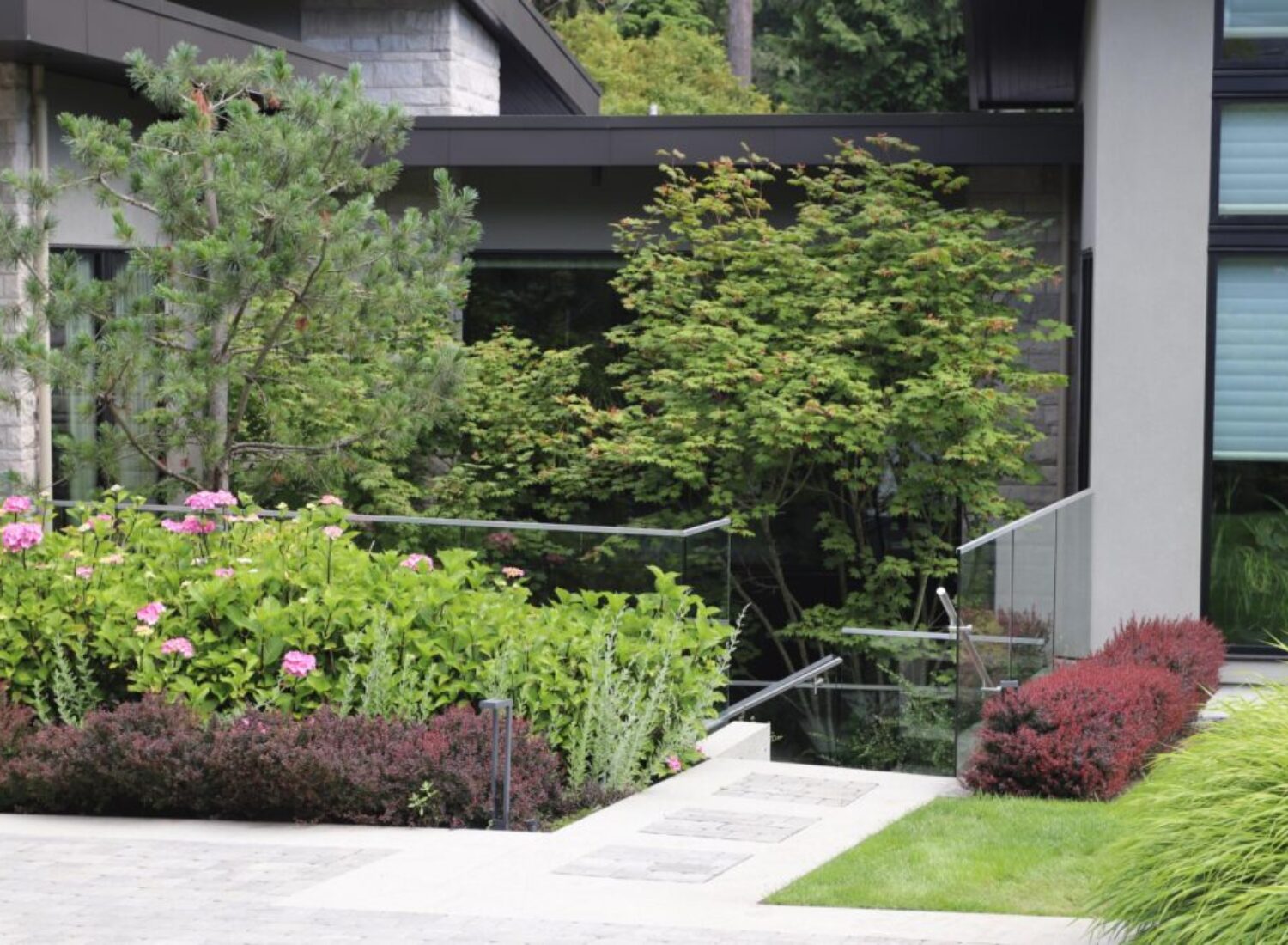 Modern home with lush landscaped garden and stairs