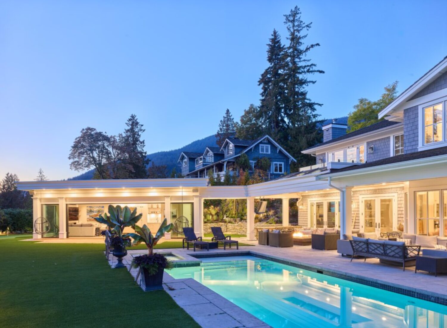 Luxury home with pool at dusk