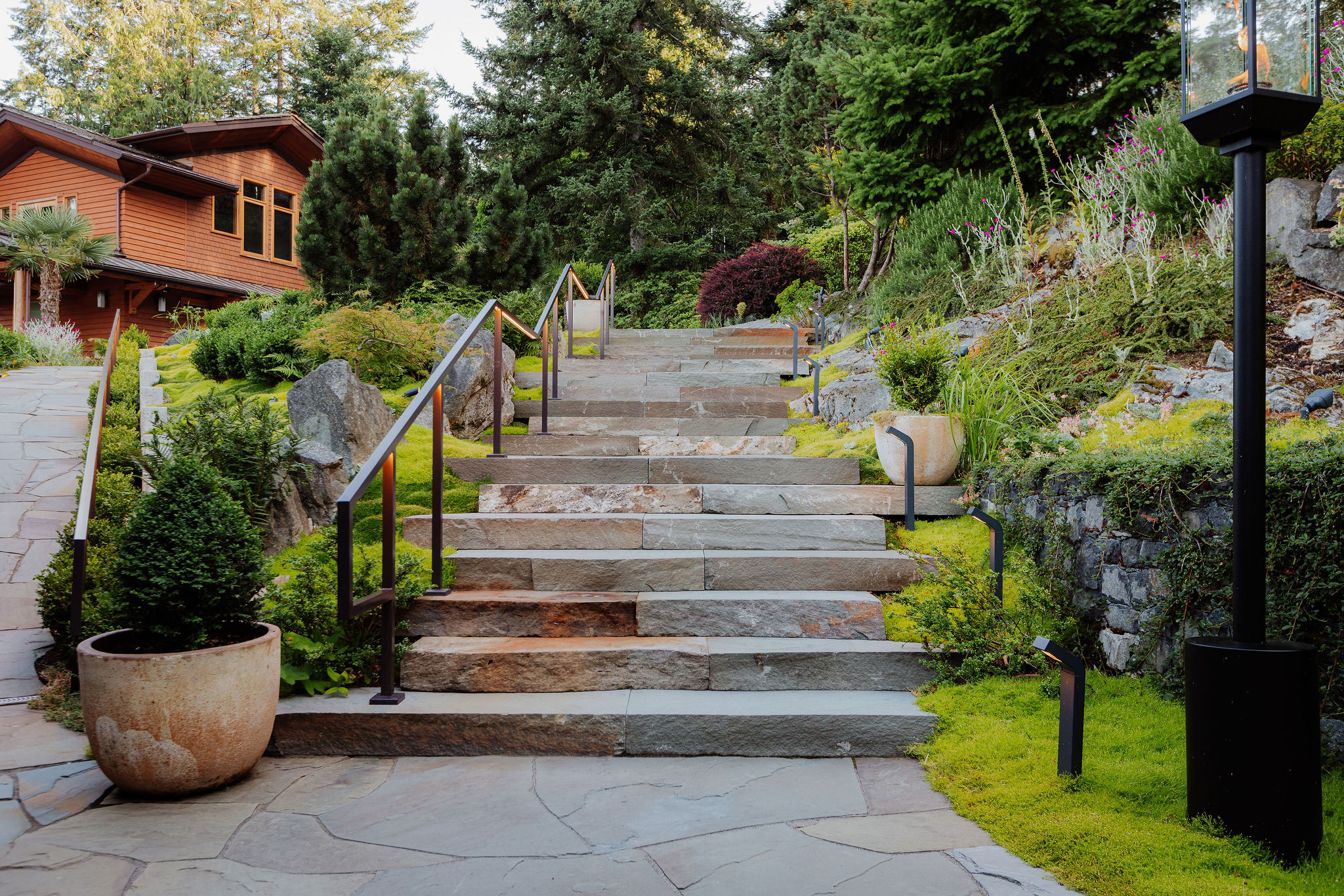 Landscaped stone steps leading to modern home