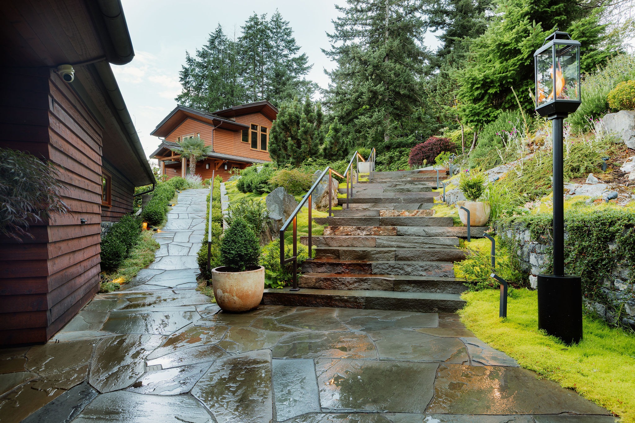 Stone steps leading to modern wooden home