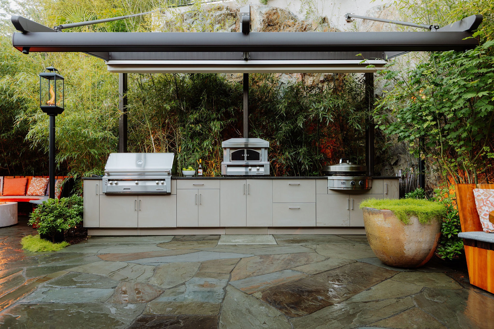 Modern outdoor kitchen with grill and pergola